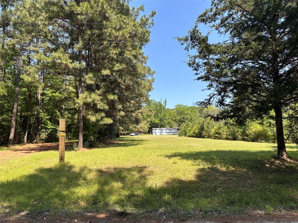 3653 County Road 1170 Kennard, Texas Peaceful acreage property in Ratcliff, just outside of Kennard. This property is just under 2 acres with a tree lined drive and lush open areas. The main home is a manufactured home that has been renovated and ready for move in. Behind is another home that could be renovated and used a the main home or a guest house. A two car enclosed garage and shed are also included. Aerobic septic system and well in place. Fridge, washer and dryer can stay with the home.