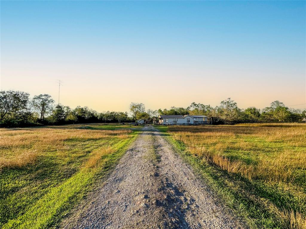 2020 Davis Bend Road Alvin, Texas Tucked away in the serene countryside of Alvin, TX, this unrestricted 5-acre property presents a rare opportunity to build your ideal retreat. The land features a beautiful mix of mature trees and open areas, offering endless possibilities for outdoor living, recreation, or future development. A mobile home is already situated on the property, providing immediate functionality or the option to customize further. Don’t miss your chance to transform this versatile acreage into something truly special. (SEE SHOWING INSTRUCTIONS)