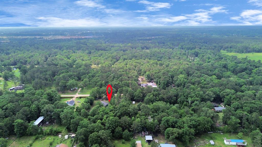 135 & 137 County 3431 Road Cleveland, Texas LAND VALUE ALERT – 3.6 ACRES PRICED TO MOVE. THE HOUSE? A BONUS! This 3.6-acre unrestricted property in 59 Estates offers exceptional value and flexibility. The existing 3-bed, 2-bath home (1,200 sq. ft., built 1999) is livable but priced with land in mind—ideal for investors, builders, or buyers seeking space to grow. Property includes central A/C, two septic tanks, and room to build your dream home, family compound, or add livestock. Comparable properties with half the acreage list well above, making this a strong equity opportunity. Quiet location, no HOA, and no restrictions—bring your vision and make it happen!