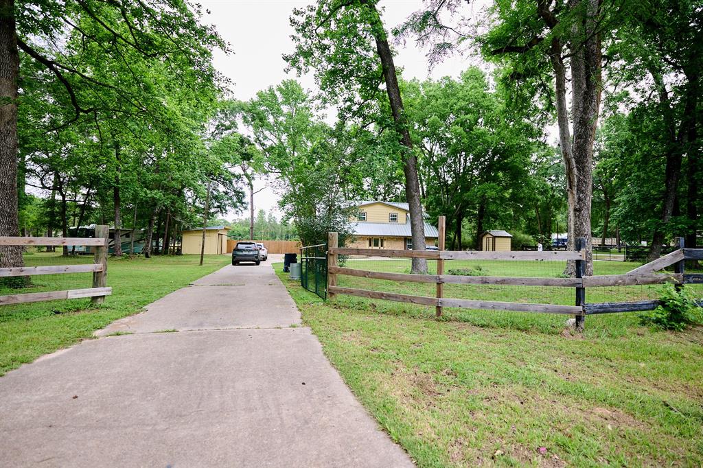 28103 Hitching Rack Lane Magnolia, Texas Unique property, just under 2 acres. The main house has 4 bedrooms and 3 full bathrooms. Granite countertops, full appliances and washer, dryer and refrigerator. The metal roof is 7 years old. Great location. No restrictions. It could be residential or commercial. Septic and water well with a new pump 1.5 HP. Spectacular wood Caney (40X30) with jacuzzi and a new guest cottage with full bathroom (36X12). shed/workshop, The property is very close to Nichols Sawmill Rd. You must see it.