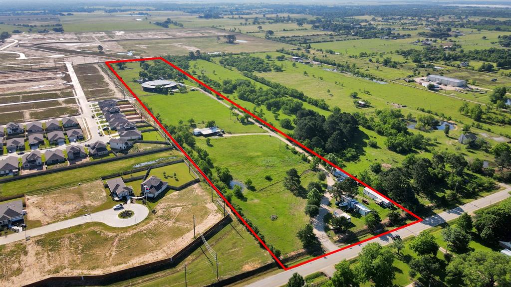 Amazing opportunity to own nearly 14.5 cleared acres in Waller with residential or commercial potential! Property includes 5 income-producing mobile homes: two 3BD/2BA, two 2BD/1BA, and one 1BD/1BA—all with individual electric meters. A 250-gallon water well, aerobic septic system, and irrigation system are in place. Features include a stable, automated entry gate, and a long dirt driveway. Four mobile homes are located near the front right side, with one in the center. A former event arena at the rear includes 10 bathrooms and was used as a plaza for gatherings (restrictions apply on type and timing of events—contact agent for details). Great for investors, event operators, or those seeking land with multiple dwellings and flexible use. Schedule your tour today!
