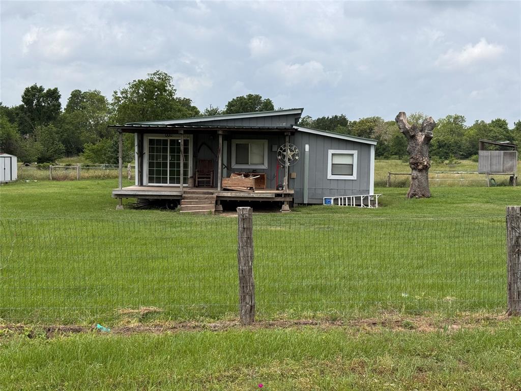 20142 Bracewell Road Bedias, Texas This 3-acre property sits on a county-maintained asphalt road outside the city limits of Bedias. The property has city water along with a traditional septic system. It is in an unrestricted area with fencing around the property, so it is perfect for horses or other livestock. The home is a cozy 2 bedroom/one bathroom cabin with a mini-split heater/a/c in each bedroom and the living area. There is a gas range and an additional gas wall mounted heater in the kitchen/dining area. The living area is all open concept which provides ample space for family activities. Just 30 minutes from Huntsville, 40 minutes from Bryan/College Station and 15 minutes from Madisonville.