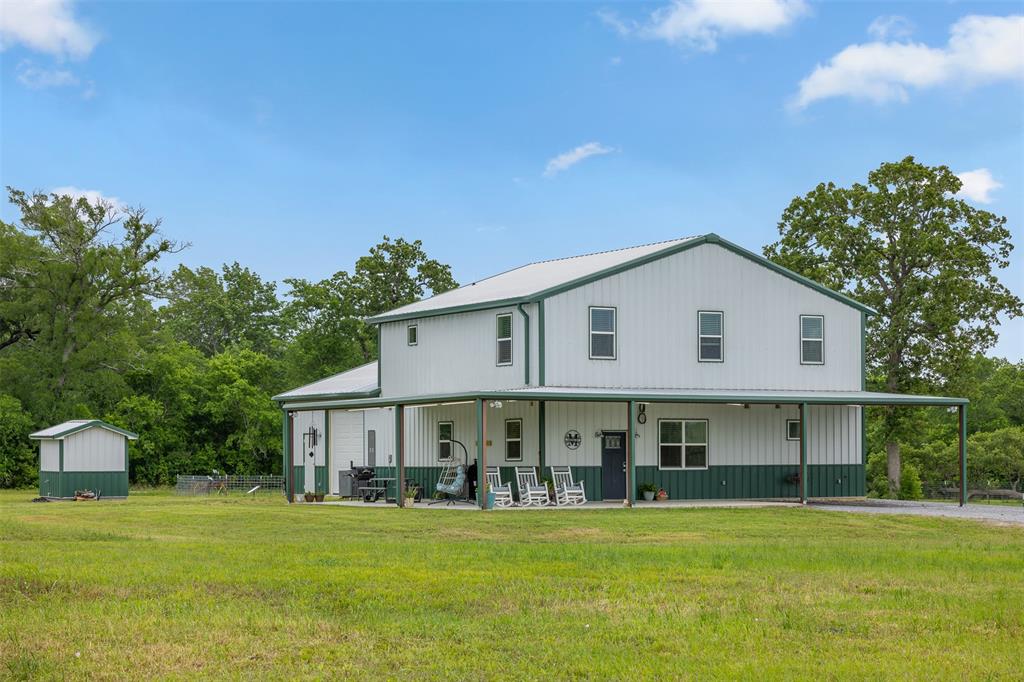 5292 Horseshoe Drive Anderson, Texas This stunning barndominium is country living done right! It sits on 6 ag-exempt, fully fenced acres in desirable Anderson. With 2,648 sq ft, 4 beds, and 2.5 baths, it blends modern farmhouse style with smart design. Inside, polished concrete floors and an open layout connect the living, dining, and kitchen areas. The kitchen is a showstopper featuring two-tone shaker cabinets, quartz counters and a large island, perfect for hosting or casual mornings. The primary suite is spacious with abundant natural light accompanied by a walk in closet and calming spa like bathroom. A spacious laundry/mudroom includes a half bath for added convenience. Upstairs offers generously sized bedrooms and an additional bathroom. Enjoy a stocked pond, mature trees, and a large front porch made for sunsets. The attached shop is ideal for a gym, workshop, or storage. Zoned to Anderson-Shiro ISD and close to College Station and Navasota, this property is the ideal escape with all the modern comforts.