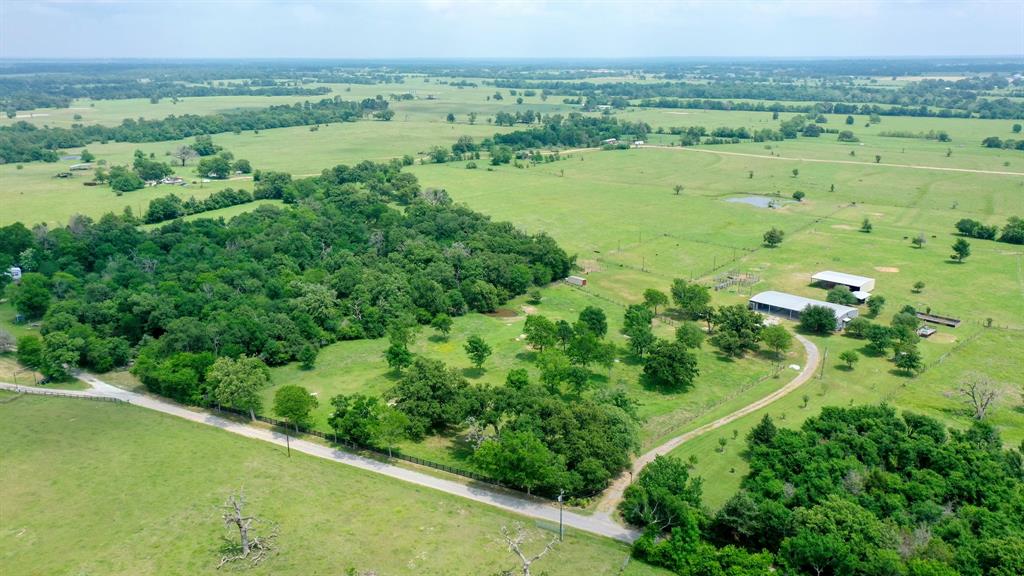 30.0124 Acres Dutton Lane Madisonville, Texas 30.0124 acres located in highly sought after Madison county, conveniently located just a few minutes from town. This property boast a completely remodeled 3 bed, 2 bath barndominium that is ready to move in! Features include: Granite counter tops, vinyl flooring, walk in pantry, walk in closets with built in dressers, breakfast bar and kitchen/dining combo open to the Living area! Must see! Many more features and updates to see! The land is currently ag exempt and used as a cattle and horse ranch with cross fencing through out and sandy loam soils. Large sprawling oaks provide sufficient shade and with a tack room, arena and barn with several out buildings, there is simply not much left to add. There are two ponds one is stocked with fish and the other is smaller and for watering livestock. This is a must see property with lots of exciting features. Contact listing agent to schedule your showing today!