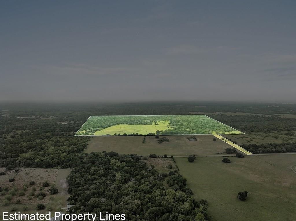 2347 Harmony Road Weimar, Texas Located near Weimar, Tx within 1.5-2 hours of Houston, San Antonio or Austin, this secluded property is a recreational/hunters dream with deer, turkey, dove, hogs & fishing. The property is approx. 60% wooded / 40% open & includes 2000'+ of the West Sandy Creek frontage. The open area provides a nice area for cattle grazing, hay production & wildlife viewing from the front porch. Nearly square in dimensions with a 60' deeded lane from paved Harmony Rd which provides easy access, but great privacy. Large Live Oak and Post Oak Trees on the property. Improvements include a water well, pond, septic system, electricity, a 14'X60' MH. Has been used only seldom since 2005 except for cattle grazing & deer hunting. The owner has priced this property for a QUICK SALE including partial Minerals/Royalty. No pipelines or production facilities. There's a 65 acre tract located immediately north that would include approx. 2400' of Harmony Rd frontage. The property has an AG Tax Status.