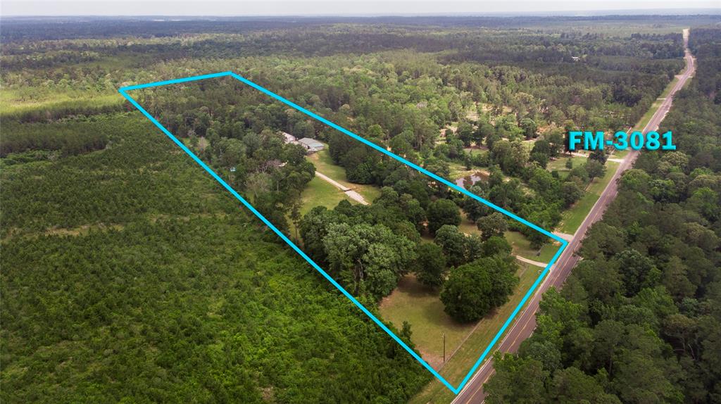 Experience serene country living sitting on 14 acres of Pure Beauty! Featuring a custom 3 bed, 2 bath home with elegant granite counter tops throughout, including window sills AND an attached 2 car garage. Enjoy warm Texas days in the in-ground pool. There is a game room or optional 4th bedroom upstairs, plus an office space or 5th bedroom! The property includes TWO large metal buildings: a 60x40 shop with an additional 1 Bed/1 Bath,  680SqFt apartment, perfect for guests or rental income, and a 80x24 workshop with four bay doors and electricity. NEW AC units provide year-round comfort. As well as a Modern Outhouse between the shops! The land is fully fenced with a blend of wooded and open space ideal for outdoor living, livestock, or future expansion. Whether your looking for a peaceful Homestead or a property with income potential, this one has it all! Located just minutes from I-45, you'll enjoy privacy with convenient access to the city. Don't miss out on this rare opportunity!
