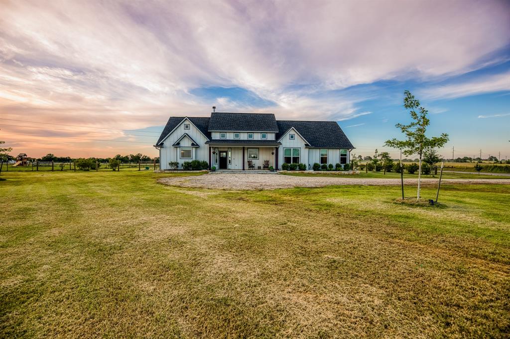 13487 County Road 175 Iola, Texas Set on 1.486 acres, this modern farmhouse blends style, function, and relaxed Texas living—complete with a pool, spacious shop, and unique custom features. The open-concept layout offers vaulted ceilings, beautiful floors, and picture windows that frame sunset views. The kitchen includes crisp cabinetry, a large island with bar seating, and a walk-in pantry/butler's pantry—ideal for daily life and entertaining. The home features 4 bedrooms, including a flexible upstairs room that doubles as an office, media room, or guest suite. A custom-built gun safe room offers secure storage or potential as a walk-in closet or hobby space. Step outside to a sparkling in-ground pool with tanning ledges and umbrellas, plus a covered patio perfect for relaxing or entertaining. Additional highlights include a detached multi-bay shop, Swisstrax garage flooring, programmable Jellyfish lighting, and a whole house Generac generator for peace of mind and high speed fiber internet access!