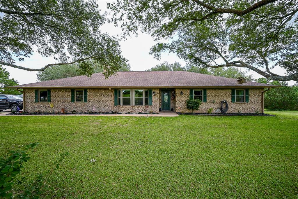 5558 Spreen Road Brenham, Texas Discover serene country living in this well-maintained 3-bed, 2-bath ranch-style brick home, perfectly situated on over 5 secluded acres. Surrounded by mature, majestic oak trees & lush green fields, with a long private driveway. Enjoy an open-concept kitchen, living & dining area with updated appliances, light fixtures, hardware, & luxury vinyl plank flooring. The oversized laundry room includes ample storage & a utility sink, while multiple closets throughout help keep everything organized. Enjoy the outdoors with a spacious covered back porch ideal for birdwatching & observing wildlife. Property improvements include a 30x30 workshop on slab with electricity & a 15x36 covered RV/boat parking area, also with electrical hookups. An additional animal/agricultural barn is perfect for hobby projects or livestock needs. Whether you're looking for a peaceful retreat, room to grow, or a space to live & work, this property offers a rare blend of comfort, function & natural beauty.