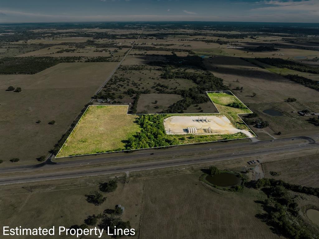 23.8 +/-acre tract of unrestricted land is positioned at the high-visibility corner of County Road 116 and State Highway 21 (Presidential Corridor) for maximum traffic exposure located just a few miles outside of the city limits. This property can provide the ideal blend of rural charm with urban convenience, making it an excellent choice for investors, developers, or those seeking to create their vision without city zoning restrictions. Access road frontage along both the county road and highway. Suitable for residential, commercial, industrial, or agricultural development. Whether you’re envisioning a residential subdivision, retail center, RV park, or a private estate, the unrestricted nature of this property provides endless possibilities. Contact an agent today for more details or to schedule a viewing!