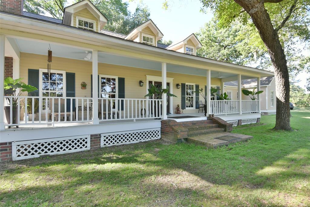 1263 Weishuhn Road New Ulm, Texas If you are looking for a grand country manor this is for you! 3 fireplaces, wood floors, high ceilings, granite, private back porch overlooking a wooded area and a lovely front porch overlooking the acreage and pond...the list goes on and on. Huge downstairs living area with wet bar and fireplace. Living area has floor-to-ceiling windows and doors to the covered back porch. The primary bedroom suite has floor-to-ceiling windows, access to covered back porch, a spa tub + separate shower + a separate attached room that could serve as a nursery or office. The office/library is just across from the primary bedroom and has a fireplace. The island kitchen features a fireplace, a butler's pantry, and abundant cabinets. Three HVAC systems are still under warranty and roof is nearly new. Upstairs has its own HVAC and can be completely closed off. 3 bedrooms and 2 baths down, plus separate living area upstairs, 2 bedrooms, and shared bath.
33 minutes from Brenham; 15 minutes from Industry.