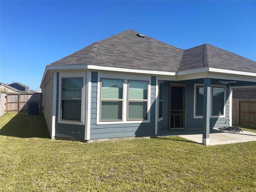 Rear Covered Patio and Lawn to enjoy Texas Breeze.