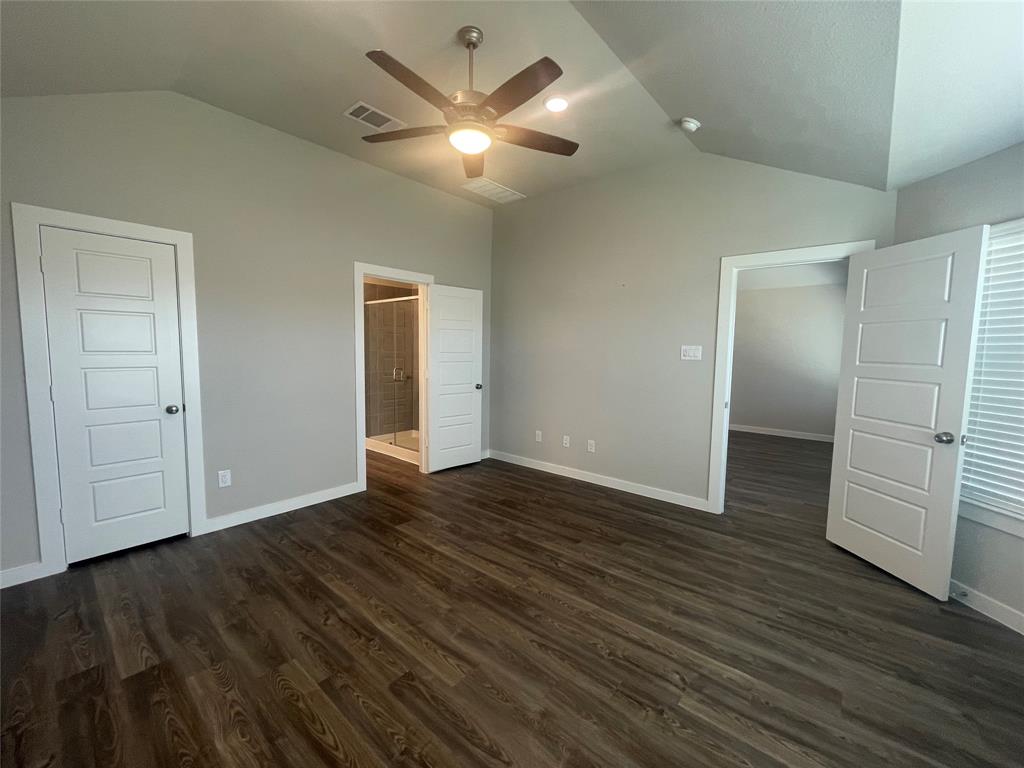 Primary Bedroom with Ceiling Fan and light Combo.