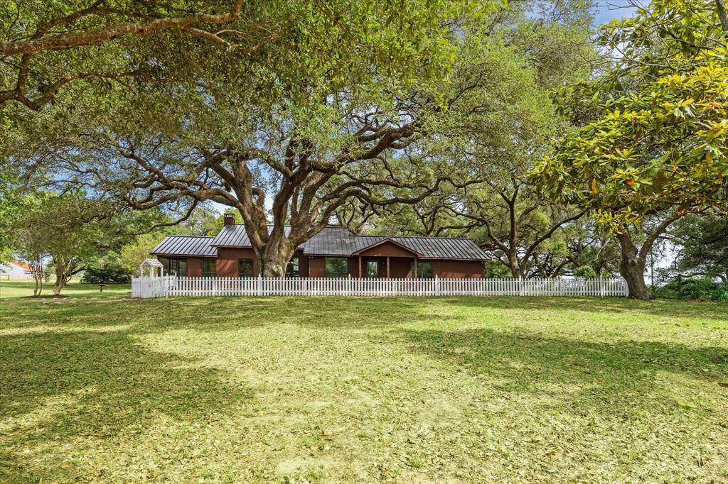 3834 Fm 949 Highway Cat Spring, Texas This home scores high on the priorities of country buyers. The location is far enough to be in rolling land, near enough and time friendly to get to Houston, wide road frontage, no flood zone or history of flooding, old established hardwood trees for shade and beauty, and remodeled to move in. The house was taken down to the studs and rafters to begin the work, so the equipment is replaced and the wiring and plumbing behind the walls, also. The "setting" here is A+ and the photos and video portray the setting well.