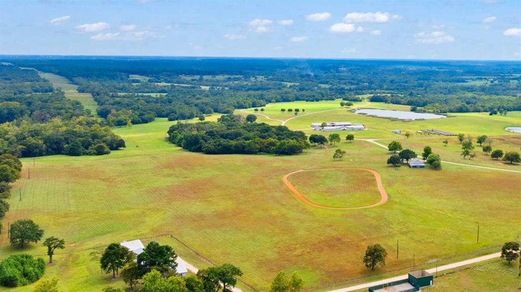 000 Tract #2 Whitehall Ranch Road Navasota, Texas Tract 2 Whitehall Ranch Estates consists of 95.48 acres. Ideal for a homesite, agriculture, and livestock. The tract features improved coastal Bermuda pastures, fertile sandy soils, and a spring-fed creek. Anchored by a 1,600 sq ft, 4-bed, 3-bath Gatehouse—elevated to capture 360-degree views. The home includes vaulted ceilings, concrete floors, solid surface counters, large living spaces, front and rear porches, mature shade trees, a two-car carport, a water well, and a propane backup generator. The fenced yard overlooks a sand oval equestrian track and a plumbed water drinker. A cross-fence opens to gently sloping terrain, creating privacy with wet-weather drainage leading to a spring-fed creek. The tract includes two rectangular equestrian pens and a round pen with 2"x4" no-climb fencing and smooth top wire. Quality craftsmanship is evident throughout, from underground utilities and steel roofing to a backup generator.