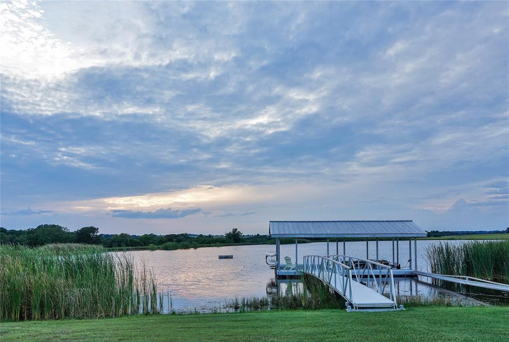 Set a half-mile off County Road 305, Tract 3 offers privacy, scenic beauty, and unique amenities. The highlight is an 8.5-acre clear, swimmable fishing lake with a pier, boat dock, and abundant bass, bream, and migratory waterfowl. Rolling terrain surrounds the lake, sweeping into a cross-fenced pasture.
To the west, spring-fed Beason Creek winds through pecans, oaks, and elms. A wet-weather creek adds habitat and seclusion, with open areas ideal for agriculture and wildlife.
In the southeast corner is a competition-spec polo field, spanning over six football fields and supported by zoned subgrade irrigation—perfect for equestrian use, vineyards, or farming.
Tract 3 combines luxury, functionality, and natural beauty in one of the area's premier deed-restricted ranch communities.