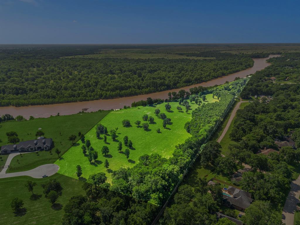 Exquisite 15.6 Acre River Front equestrian homesite located in the prestigious Fulbrook Estates. This outstanding property provides privacy of living on a quiet cul-de-sac street within an upscale and secluded community surrounded by nature! Build your Custom Estate home with Breathtaking views of the Brazos River from your backyard with tons of wildlife to watch. Brickmoon, an award-winning residential architecture and interior design firm, has collaborated with sellers to produce a stunning home rendering with ideal placement on this lot. Plans can be purchased from architect for an expedited build process. Fulbrook offers nature trails, parks, the casting dock, boat slips for kayaks and canoes as well as the incredible peace and quiet of the country. No time limit requirements to build and no living area square footage requirements for the primary residence. Can be subdivided with HOA approval. Low taxes and no MUD! Check out the virtual tour link!