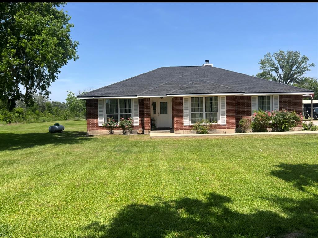 Welcome to this COUNTRY BEAUTY situated on 10 unrestricted acres! This home offers 4 bedrooms and 2 full baths. It has a large living room area with a wood burning fireplace. It has a second living area that could be used as a home office or second hangout area. The primary bedroom offers a sitting area as you walk in the room along with a nice sized bathroom and walk-in shower and walk-in closet. The other three rooms are sat on the opposite side in a split floor plan with a second full bath as well. Enjoy the outside of this home as it comes with a shop, barn, chicken coop and the back of the property fenced and crossed fenced ready for livestock. The spacious 30x40 shop comes with a covered 30x20 carport and the side of the shop has a 40x 12 lean-to where you can enjoy relaxing and cooking in the shade while watching the deer come in and out of the wooded area in the back. This home has a new roof 2025 and new water well 2025. Don't miss out on this beautiful country property!