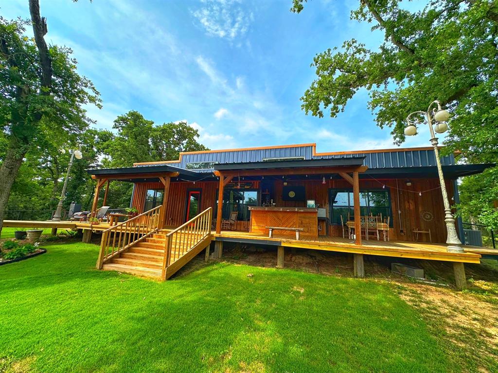 5024 FM 39 S Marquez, Texas Charming Country Retreat on 11.88 Acres – North of Flynn, TX
Escape to the peace and privacy of this beautifully updated country haven in Leon County, just north of Flynn. Nestled on 11.88 fully fenced acres, this picturesque property offers the perfect blend of modern comfort and rustic charm.
Step inside the newly remodeled 1,920 sq. ft. home featuring an open-concept layout, updated finishes, and spacious living areas designed for both relaxation and entertaining. The real showstopper awaits out back — a large covered porch deck overlooking a serene pond, complete with a built-in outdoor bar area ideal for gatherings, grilling, or simply enjoying quiet Texas sunsets.
For those with outdoor hobbies or RV lifestyle, the property also boasts a large, multi-use pole barn fully equipped with electricity, water, and septic — perfectly set up for RV hook-up or workshop use.