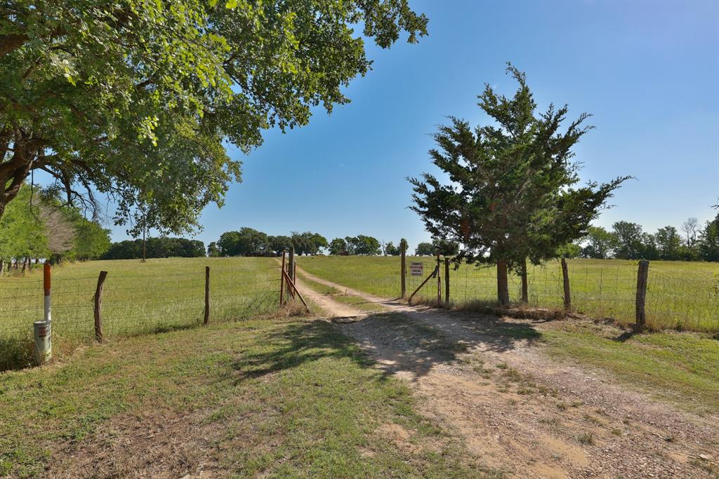 00001 CR 305 Road Navasota, Texas Discover 22 acres of gently rolling green pasture, crowned by majestic oaks at the hilltop. This picturesque property features an inviting 2-bedroom, 2-bath cabin—ideal for a weekend retreat or a comfortable home base while you build your dream residence.
Enjoy breathtaking 360-degree panoramic views: take in the charming town of Whitehall to the west, a nearby game ranch to the north, and expansive cattle pastures stretching to the south. Whether you're seeking peace, recreation, or a future homesite, this land offers a rare blend of beauty, comfort, and potential.