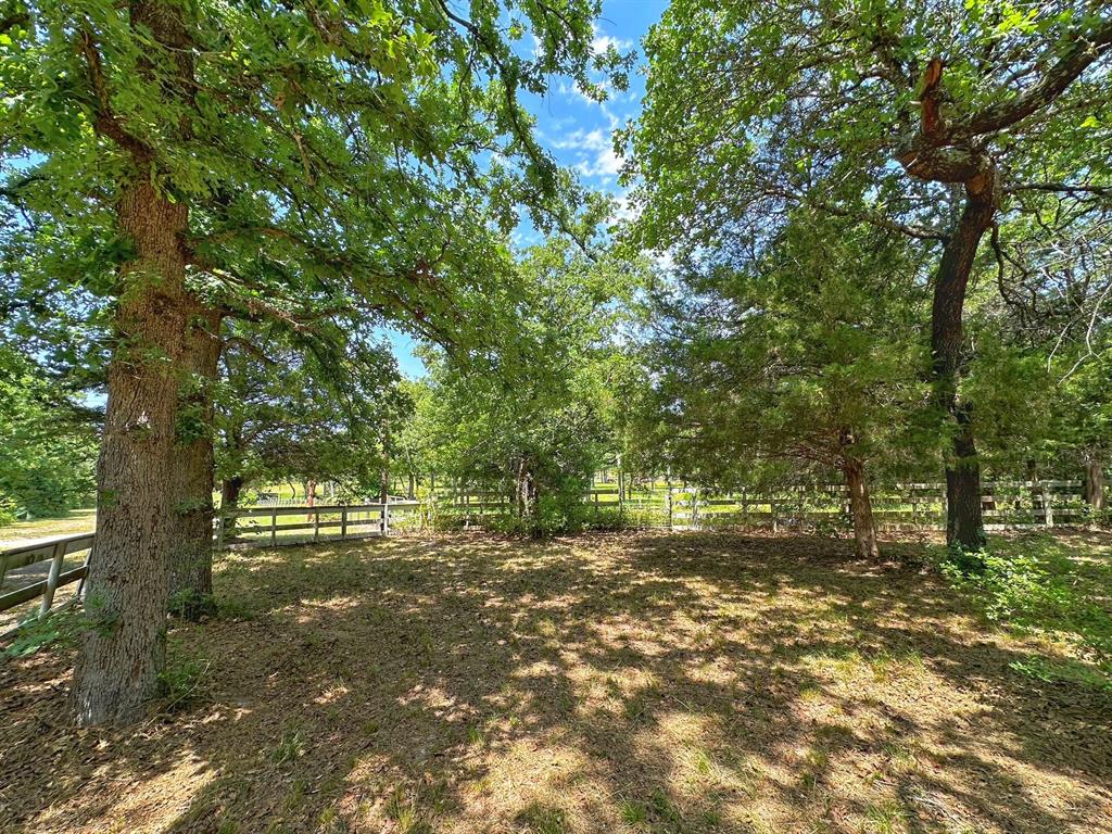 7.79 acres east of Centerville.  One room cabin in a great setting with plenty of oak trees providing shade.  Several outbuildings for storage an a nice patio to sit and enjoy nature.  Property is fenced and has everything you need for a perfect weekend getaway.