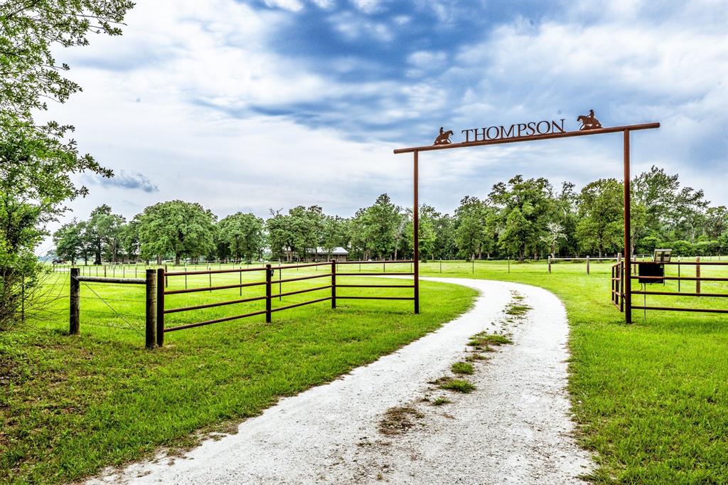 4706 S County Road 458 Normangee, Texas Beautiful 2 bedroom 2 bath split concept barndominium on 36.06 well kept acres with beautiful trees, fenced & cross fenced divided into 3 pastures, small pond with a sm. creek running through the property. Electric gate entry. Hay has been cut off of all pastures. Kitchen/dining room & living room is open concept. Home has Utility/Mud room, walk-in pantry, & gas stove. There is a Generac generator that will run the whole home. Home was built in 2020 with 1840 sq.ft. living space & front & back covered porches with 368 sq.ft. each with entrances to the home from both. The home has at one end an attached, covered 3 space 960 sq.ft. carport with an entrance into the Utility/Mud room which sets off the Kitchen. There is power & water to the Shop/Barn & Tack room. Water is also available to all pastures & the well house was built in 2020 with 144 sq.ft. This barndo & acreage sits off the County Rd. with a long rock road winding up to the attached carport. Hay production & Lg. trees.