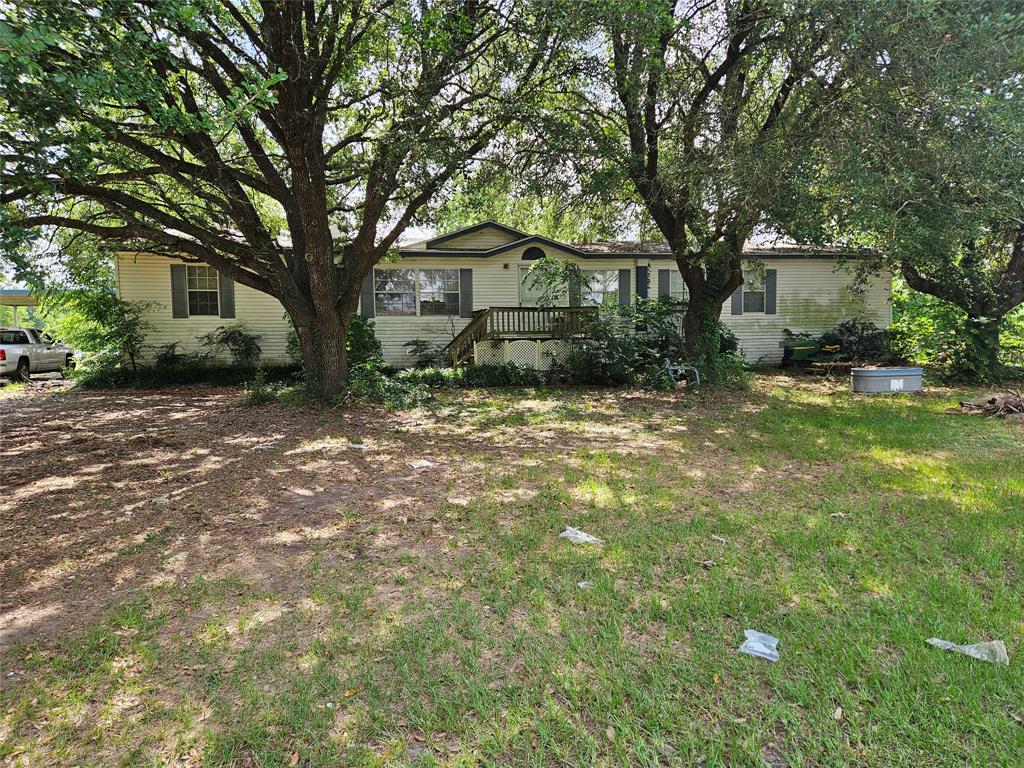 Rare Investment Opportunity in Cypress, TX! Over 4 unrestricted acres offer endless possibilities for buyers, builders, and investors alike. Just minutes from the Grand Parkway, this prime location combines convenience with versatility. The property boasts top-tier equestrian facilities for horse lovers or hobbyists. The barn could easily convert into a warehouse or storage space, while the spacious 2,200 sqft double wide home offers comfortable living or an ideal office setup. Enjoy covered front and back porches, a private fenced backyard, and the peace of mind of no history of flooding. With no HOA or MUD district and zoning for Tomball ISD, this property welcomes all livestock and FFA projects. Motivated seller—don’t miss out on this incredible opportunity! Additional adjacent 4+ acres and home also available for sale!