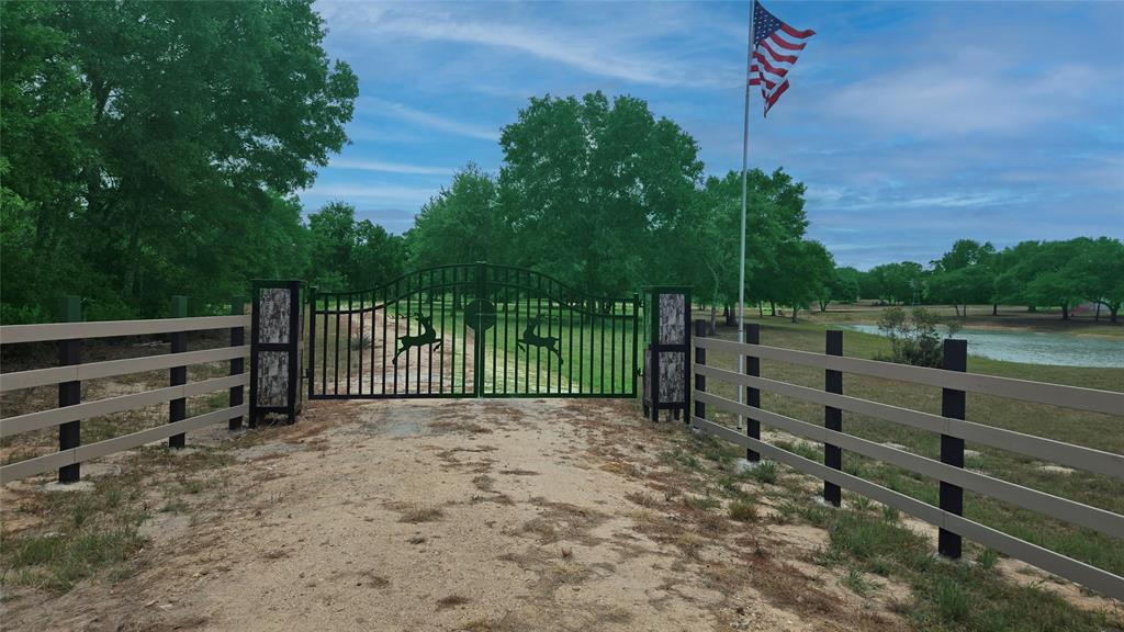 1152 Big Buck Drive Weimar, Texas Escape suburban life and own your piece of Texas freedom on this 14.942-acre retreat in the private, gated Oakridge Ranch community. Ideal for bird enthusiasts, hunters, ranchers, or anyone seeking peaceful country living, this scenic property offers a perfect blend of open pastures and wooded areas ideal for building your dream ranch or homestead. Enjoy a stocked catfish pond with windmill-powered aeration, a new 220' water well, upgraded controlled-access gate and road, and an insect habitat structure that helps protect the majestic live oaks. The land is thoughtfully cross-fenced into 3-sections to optimize use and livestock management. A well-built 576 sq. ft. insulated metal building includes an overhang and rough plumbing perfect for storage or future build-out. Multiple tax exemptions eligible for lower property taxes. Lots of wide open skies, peace, and quiet 90 minutes from Austin, Houston, or San Antonio. No state income tax makes this an ideal out-of-state relocation.
