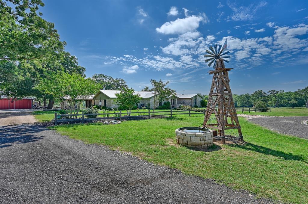 Discover serene country living on this working gentleman's ranch near Lexington. The home offers 3 bedrooms plus office and has been thoughtfully renovated to capture the spirit of ranch-style living. Stay connected with CAT 5 wiring and rest easy knowing home is backed up by a generator w/ dedicated 1000-gal propane tank. There are a variety of structures to support diverse livestock operations. The barn includes a feed/tack room & stalls, while small animal pens with water and multiple loafing sheds offer options for animal care. The property is completely fenced and cross-fenced for optimal animal management. A lg carport by barn provides protection for ranching equipment. A 30x30 metal shop with a vehicle lift near the house is perfect for projects and a variety of uses. Enjoy the outdoors with a stocked pond, orchard, and patio & garden area. A storm shelter offers peace of mind. This property is a blend of rustic elegance & practical functionality. Come see what it has to offer!