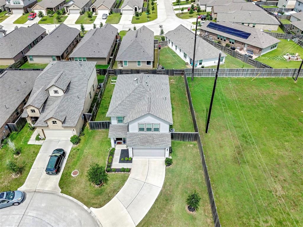 Aerial view of the property showcasing the extra long driveway & no side neighbors