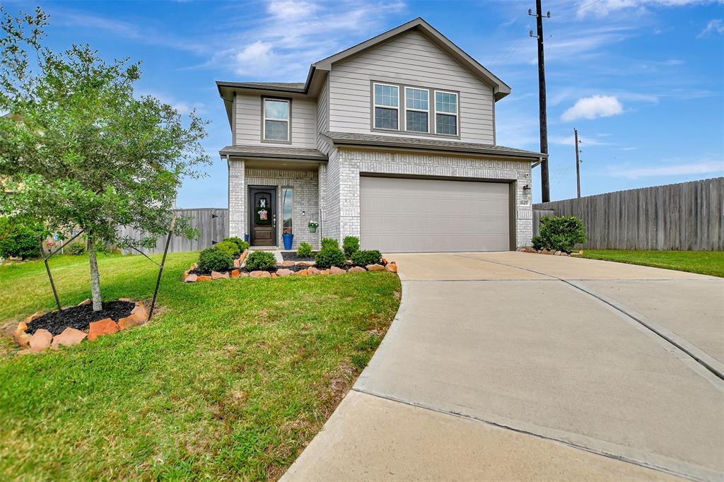 Extra long driveway and manicured lawn