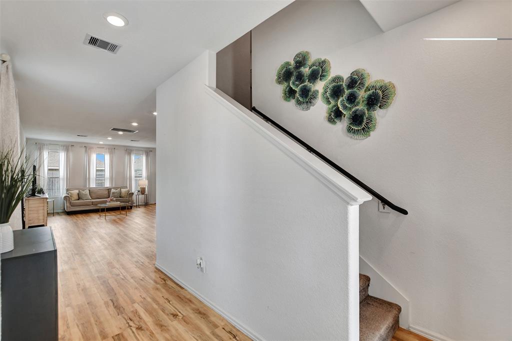 Staircase leads to all 4 bedrooms upstairs