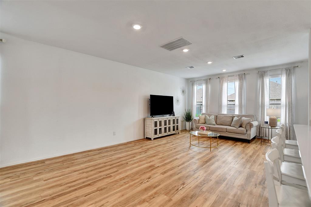 faux-wood flooring throughout the main living areas