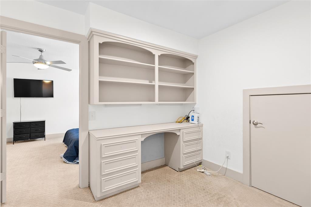 Your versatile built-in workspace combines open shelving and ample drawer storage, perfect for homework, crafting, or a compact home office. Located just off the bedroom, it also includes a low-profile storage door for stashing seasonal items or keeping clutter out of sight.