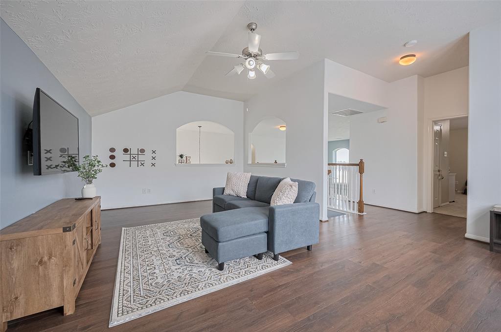 Located upstairs, this cozy second living area is perfect for movie nights, gaming, or relaxing with family. With plush carpeting, soft lighting, and a comfortable layout, it’s an ideal spot to unwind and enjoy your favorite shows in a more private setting—away from the main living space.