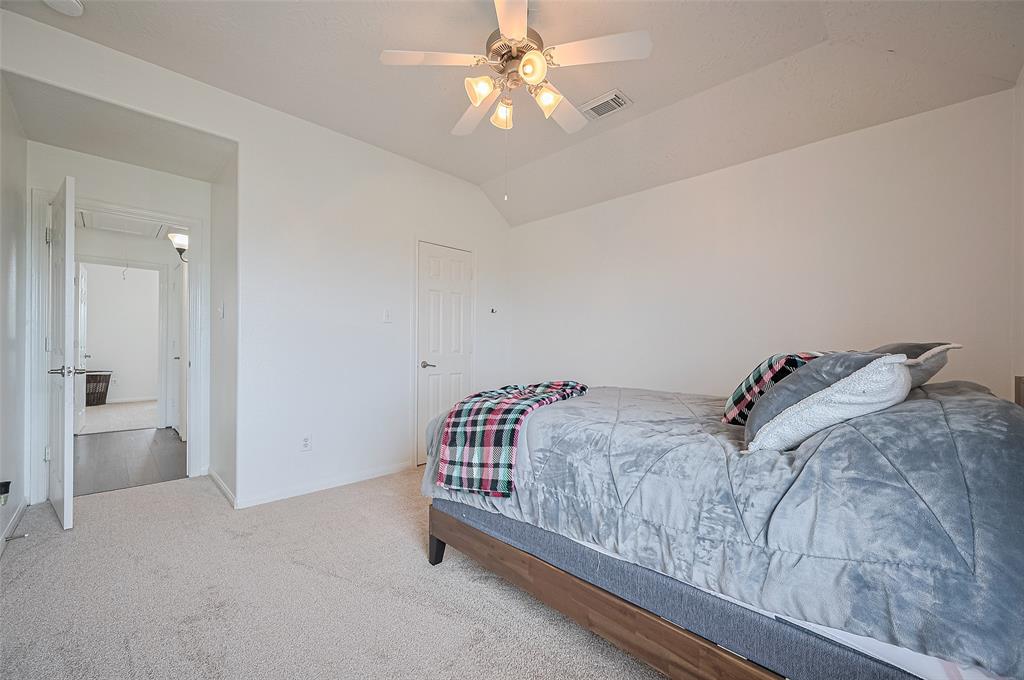 This secondary bedroom offers generous natural light, a full-size closet, and a peaceful atmosphere—perfect for family, guests, or even a hobby room. Its versatile layout allows for easy furnishing while maintaining comfort and style.