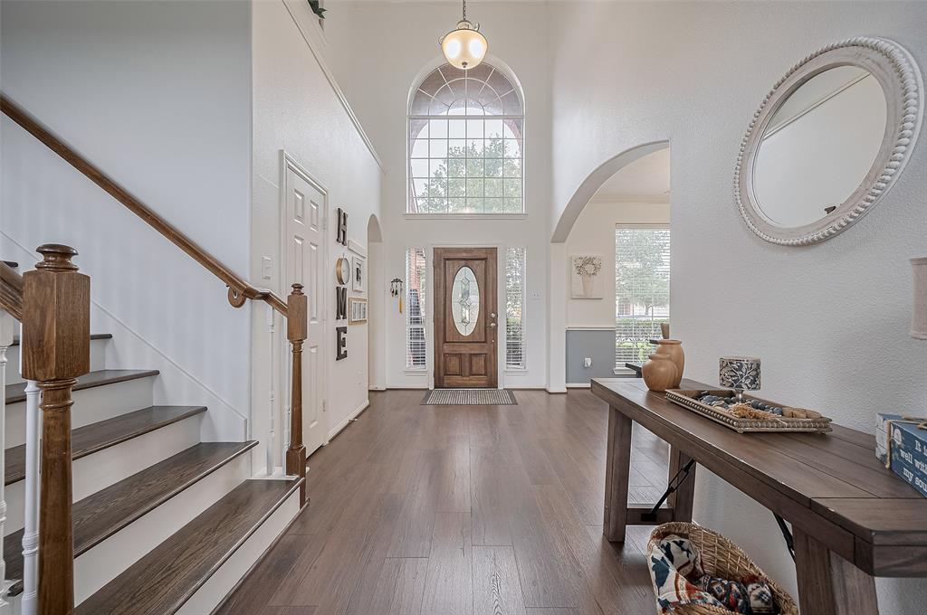 Step inside to soaring ceilings and a light-filled foyer that opens to the heart of the home.