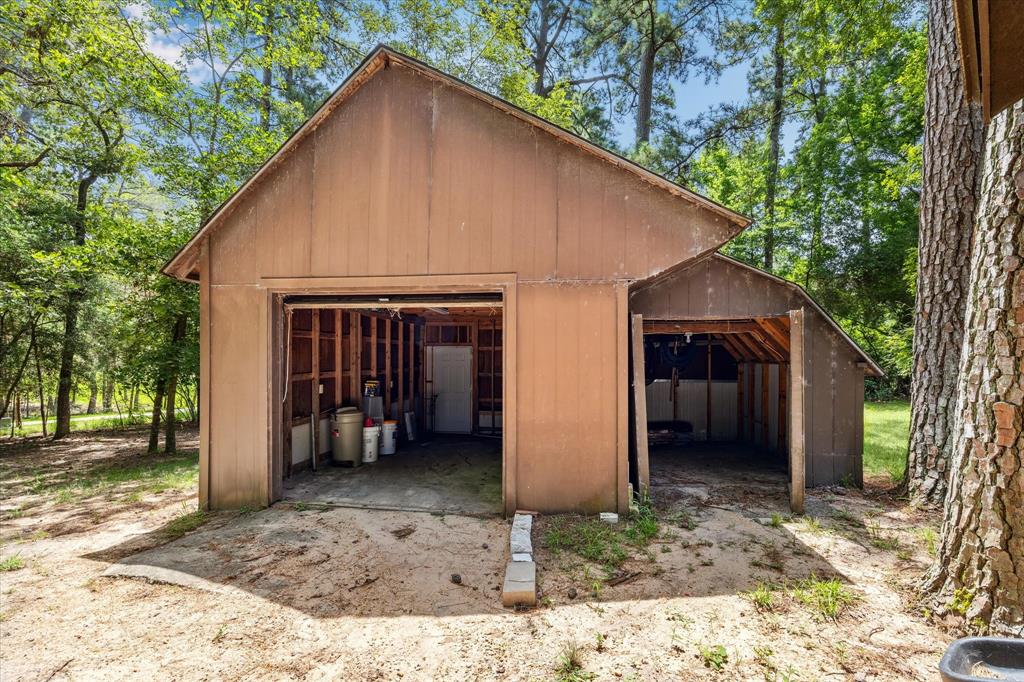This is the shop and the shed. The shop was actually built around the shed and they used to restore cars in here and kept all of the yard maintenance stuff in the shed.12190 Willowridge Cir