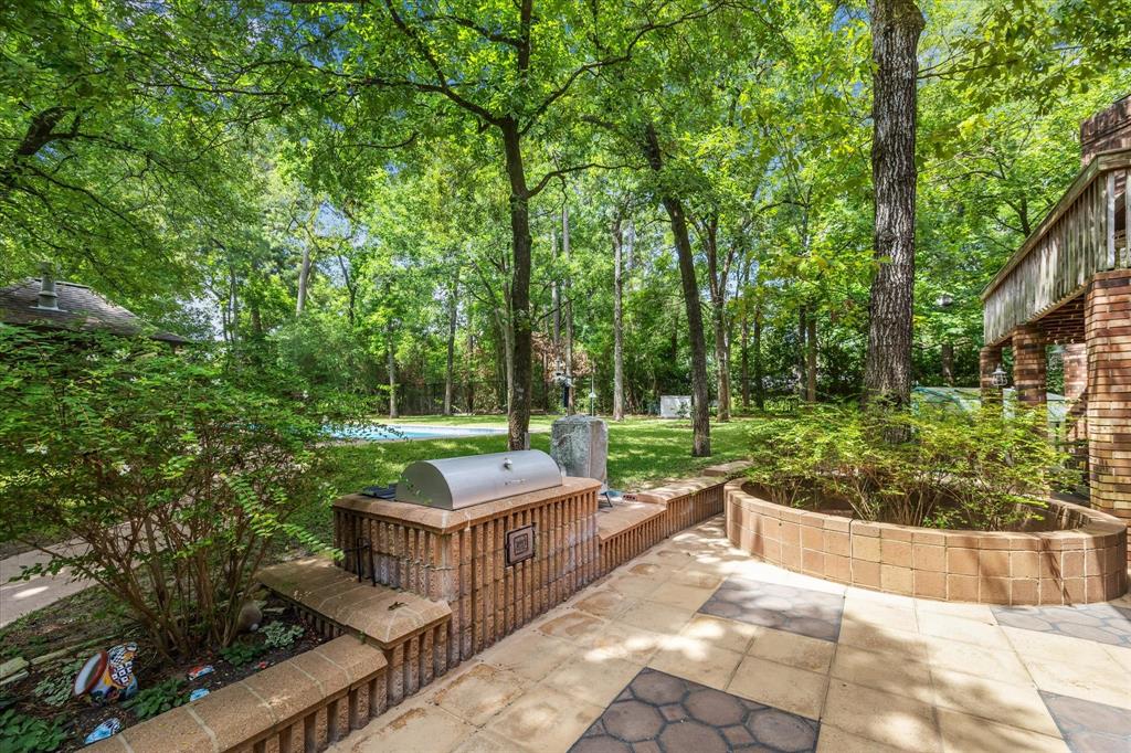 This pic is showing off the gas powered built in bbq pit, the Pecan, Apple and Fix trees!12190 Willowridge Cir