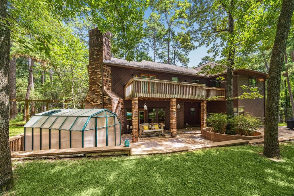 A pic of the back of the home without the veggies inside, You can create your own garden. It will be fun! There is a water barrel on that side as well, behind this that makes watering easy. 12190 Willowridge Cir