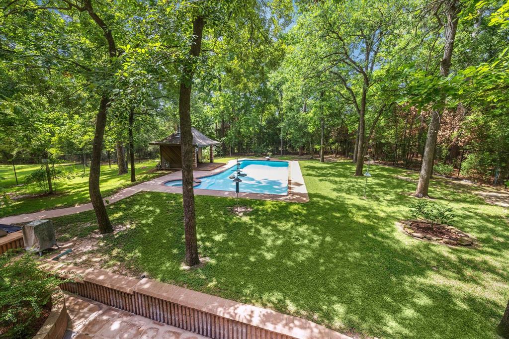 Simply Peaceful Paradise in a pic! These outside pics have not been altered; it is really this green and pretty!12190 Willowridge Cir