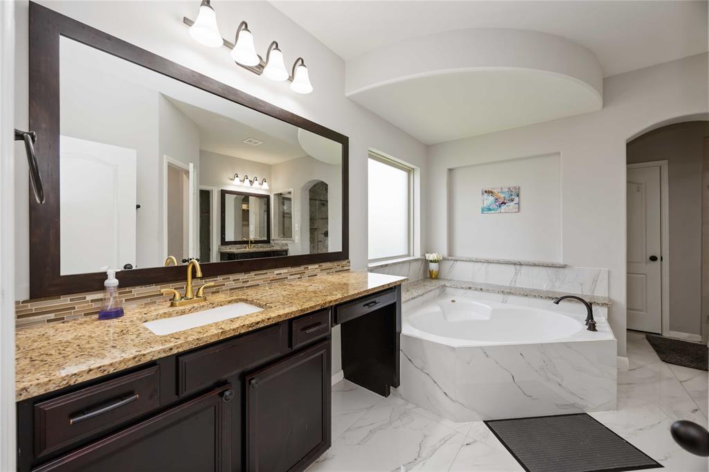 Luxury ensuite bathroom with one of the dual vanities