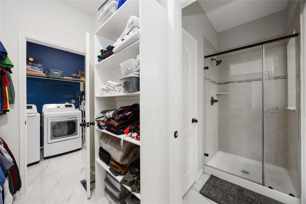 The laundry room connects to the primary bedroom