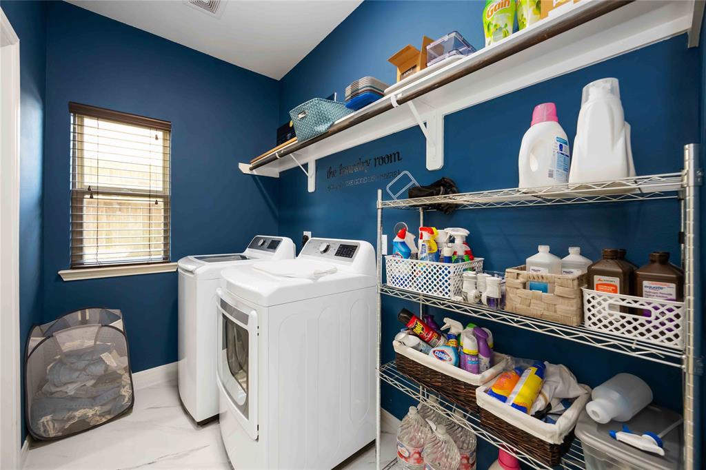 Laundry room with ample space and shelving