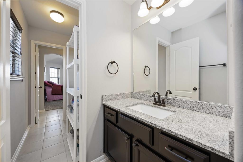 Jack and Jill bathroom, two vanities flanking the shower in the middle