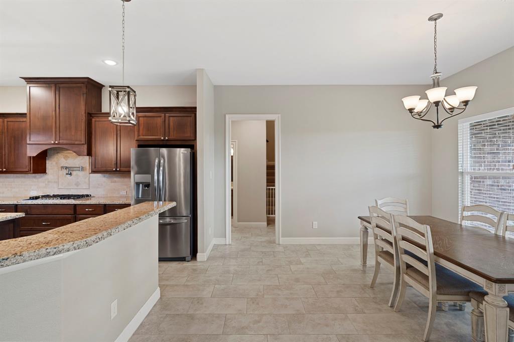 The open kitchen dining concept allows you to stay in touch with family and guests during meal prep time. The large wrap around breakfast bar is perfect for those meals on the go.