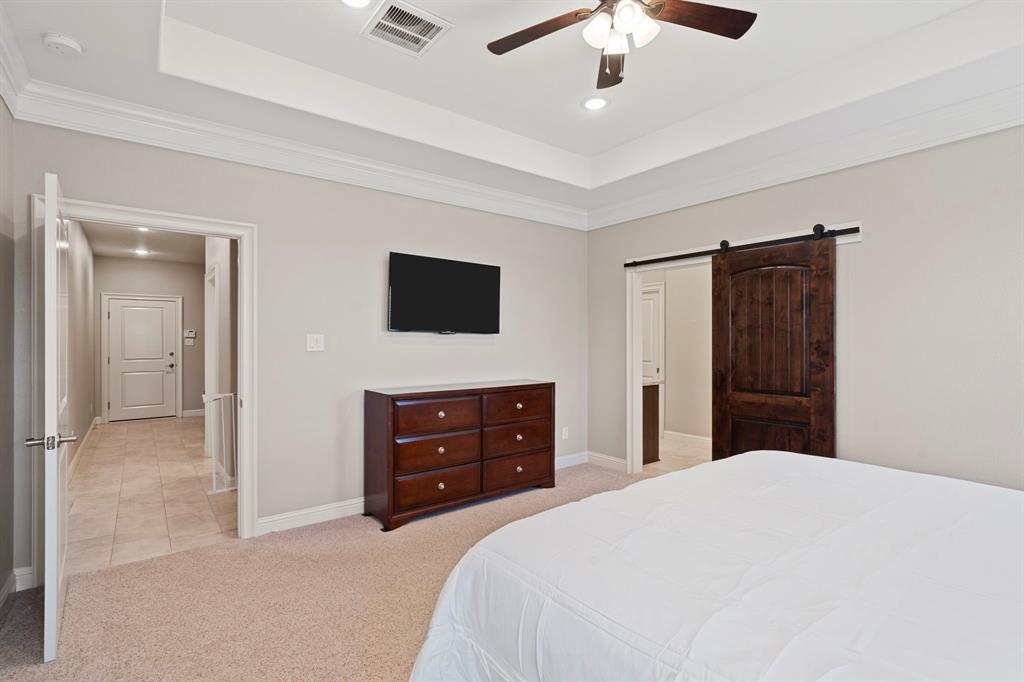 Another view of your primary retreat. The split floor plan offers the ultimate privacy. A glimpse of the luxurious en-suite bath.