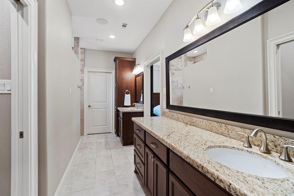 Luxurious spa like primary bath is absolutely stunning. Separate dressing areas and two massive walkin closets.