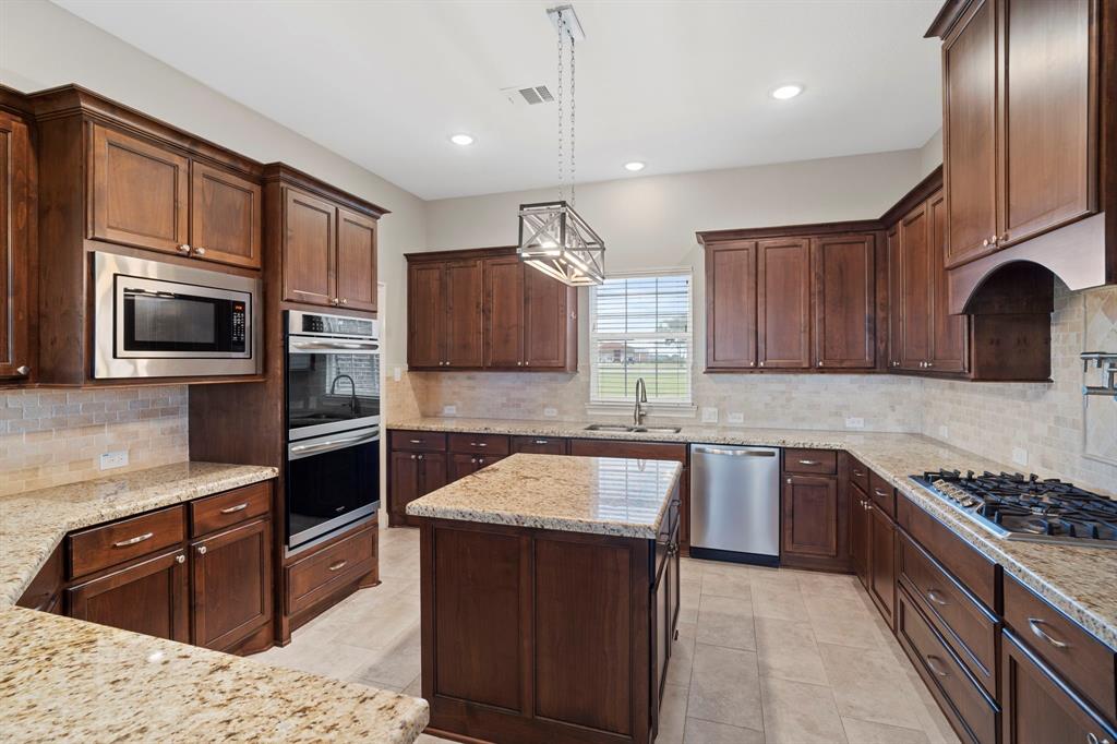 A closer look. Every detail has been meticulously crafted to blend functionality with opulence, promising an unmatched cooking and entertaining space for both host and guests alike. Large walk in pantry.