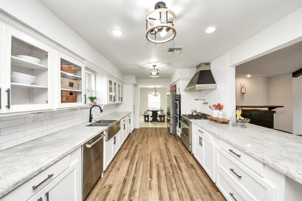 Updated and elegant, this kitchen is a chef’s dream with top-tier features and thoughtful design.