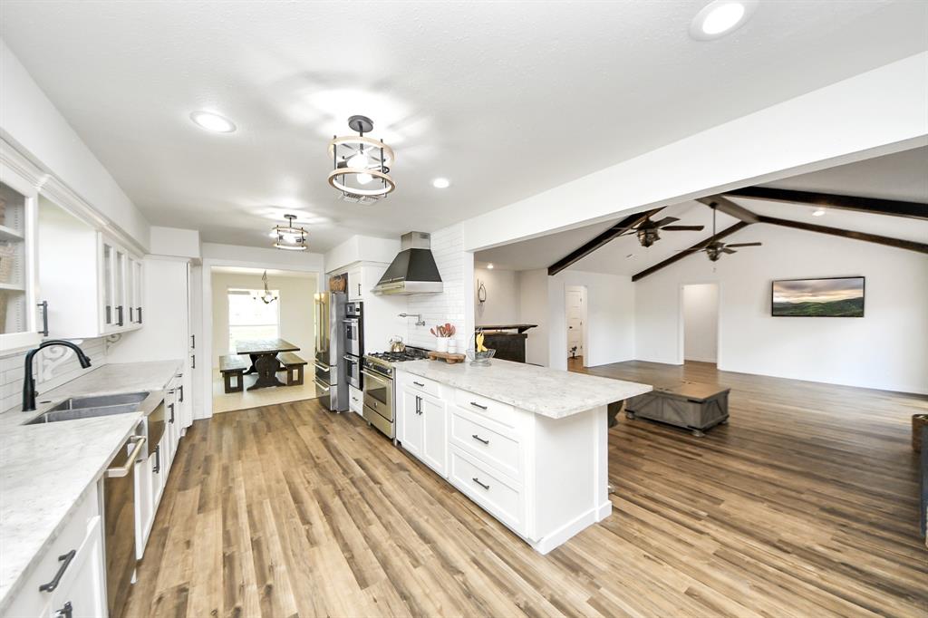 Enjoy effortless entertaining—prep meals while staying part of the conversation with views from the kitchen into the spacious living room.